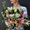 Bouquet of pink and white lilies with eucalyptus greenery