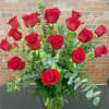 Bouquet of red roses in a clear glass vase