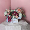 A romantic and luxurious floral arrangement that blends soft blush tones with