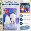 Paint-your-own space figurine kit with two unpainted figures, brushes, and paint pots