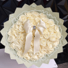 Cream rose bouquet with a satin bow and pearl trim