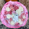 Pink and white rose bouquet with a ghost topper and pink wrapping