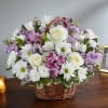 Basket of white and purple flowers with roses and daisies