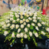 Large white floral spray with roses and lilies
