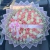 Pink and white rose bouquet with a "I Love You" ribbon