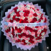 Large bouquet of red and pink roses with baby's breath and a ribbon