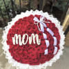 A lush, tightly packed round bouquet of red roses crafted to celebrate