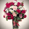 Overflowing with charm and romantic color, this stunning arrangement features deep pink