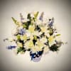 Elegant and calming, our Peaceful Reflections Bouquet blends soft ivory lilies, roses