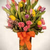 
Brighten any space with this cheerful and vibrant floral arrangement. A stunning