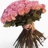 Large bouquet of pink roses tied with a ribbon