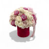Bouquet of cream and pink roses in a red velvet box