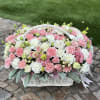 Pink and white flower basket with a white handle