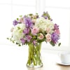 Pink and purple bouquet in a clear glass vase