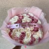 Pink and white rose bouquet with a satin "I love You" ribbon