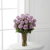 Lavender rose bouquet in a clear glass vase