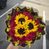 Bouquet of red roses and sunflowers wrapped in black paper