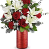 Red roses and white lilies in a red vase
