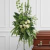 A peaceful display of affection and sympathy, this monochromatic spray of gorgeous