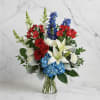 Perfectly patriotic with its red, white and blue blooms, this bold bouquet