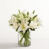All-around arrangement with all white flowers, designed in a glass cylinder vase.
Standard