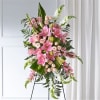 Tall pink and white floral standing spray on an easel