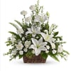 White lilies and carnations in a wicker basket