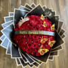Round bouquet of red roses with a birthday ribbon and butterfly decorations