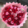 Bouquet of red and pink roses with a pink plush toy