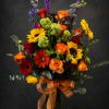 Bold, sunlit color greets the recipient with this tall mixed flower arrangement-perfect