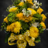Sunlit yellow roses and chrysanthemums take center stage in this cheerful flower