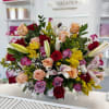 Mixed bouquet of roses and lilies in a glass vase