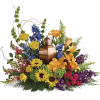 Colorful floral arrangement with a copper urn centerpiece
