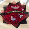 Red rose bouquet with a jeweled crown and birthday ribbon