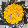 Bouquet of yellow roses with black patterned wrapping and butterfly accents