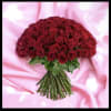 Bouquet of red roses on a pink satin background