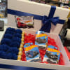 Gift box with blue ribbon, faux roses, and Hot Wheels toy cars
