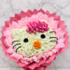 Cat-shaped floral arrangement with pink and white flowers on a marble background