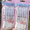 Two Hello Kitty pen sets in pink packaging