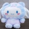 Pastel blue and lavender plush bunny with long white ears