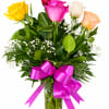 Bouquet of multicolored roses in a glass vase with a pink ribbon