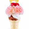 Pink carnations and a red rose in an ice cream cone vase with a birthday topper
