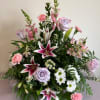 Bouquet of pink and lavender flowers with lilies and roses