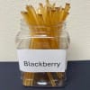 Clear jar filled with amber-colored sticks labeled Blackberry
