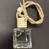 Clear glass car air freshener bottle with a braided hanging cord