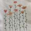 Floral print with tall pink and peach flowers on thin stems