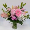 Pink and white mixed bouquet in a clear glass vase