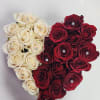 Heart-shaped arrangement of cream and red roses with jeweled centers