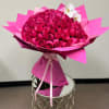 100 Long-stem roses + 1 stem of orchids in our Signature wrap