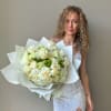 Premium mix of roses and spring flowers in our Signature wrap